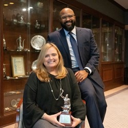 Brandon Wilson and Missy Burchart with the Silver Anvil Award