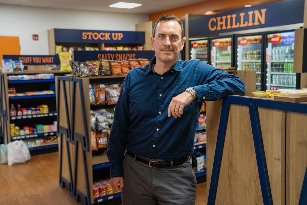 Xaq Frohlich standing inside a grocery store
