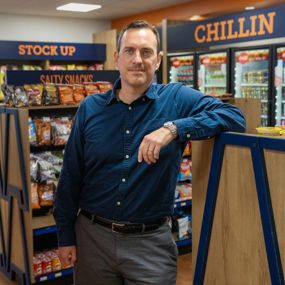 Xaq Frohlich standing inside a grocery store