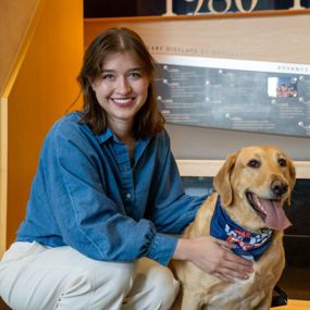 Marianna Spiotta and dog posing for a photo