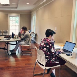 Faculty writing at Pebble Hill retreat