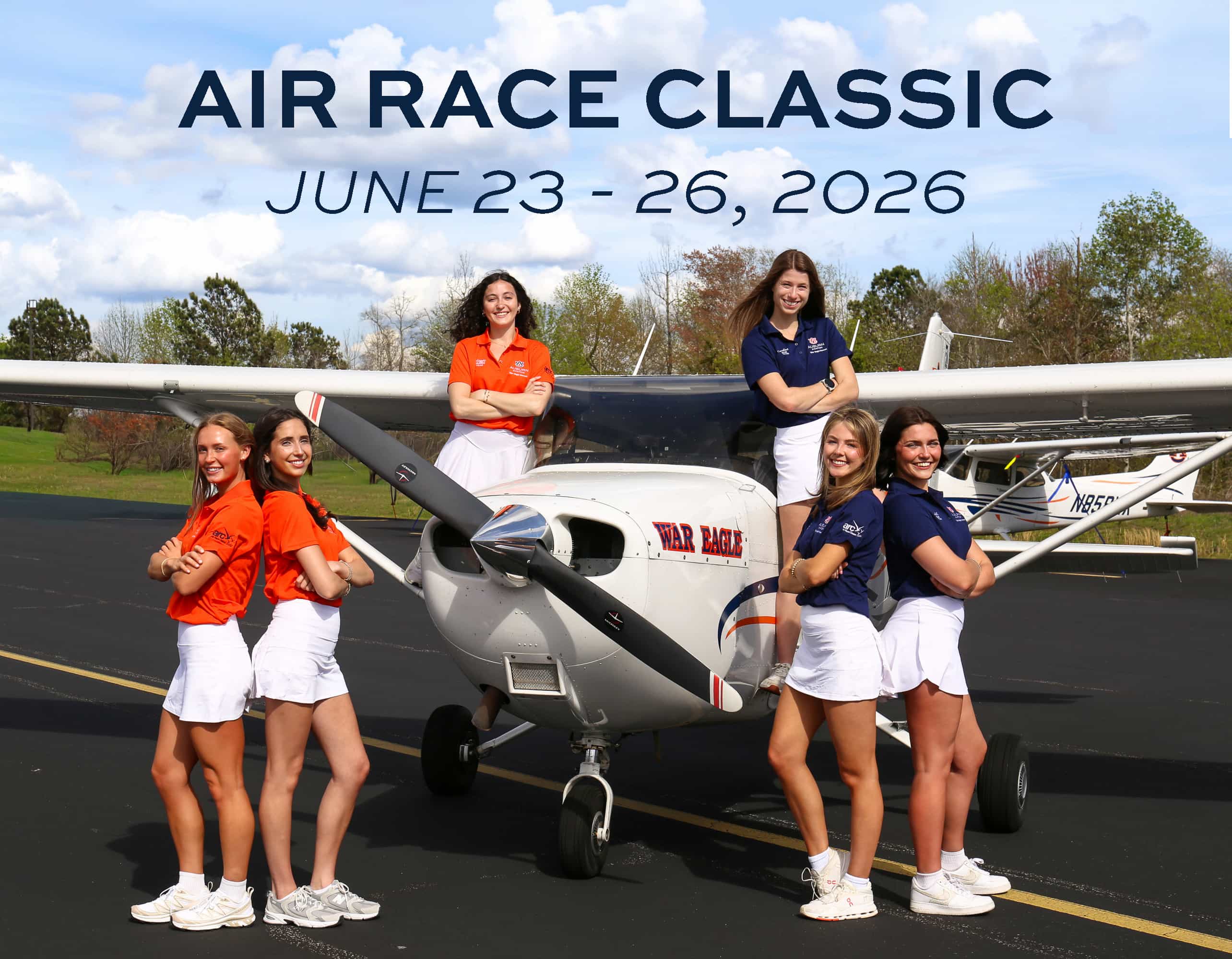 Air Race Classic June 23-26, 2026 - War Eagle Women Blue Team and War Eagle Women Orange Team standing in front of Auburn airplane