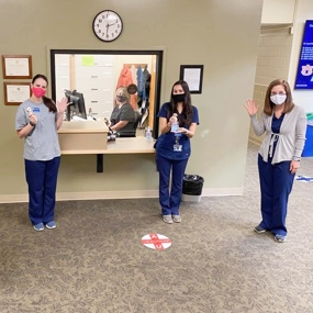 Clinicians and staff in the lobby of the speech and hearing clinic