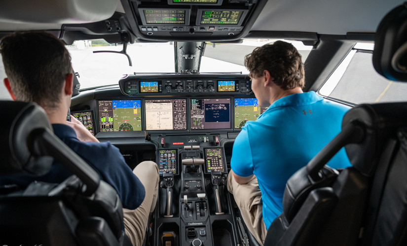 two people sitting in a cockpit