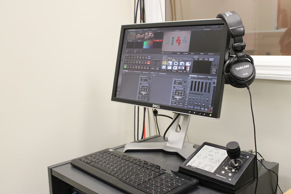 A photo of computers in the LUCIA lab control room running the Tricaster Broadcasting software. 