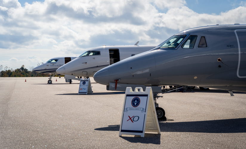 3 jets parked at an airport