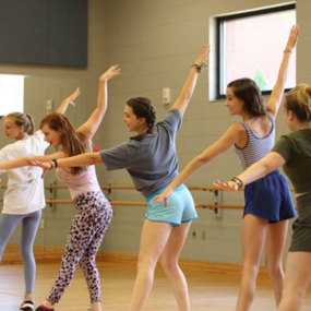 Five students dancing in the musical theatre summer camp
