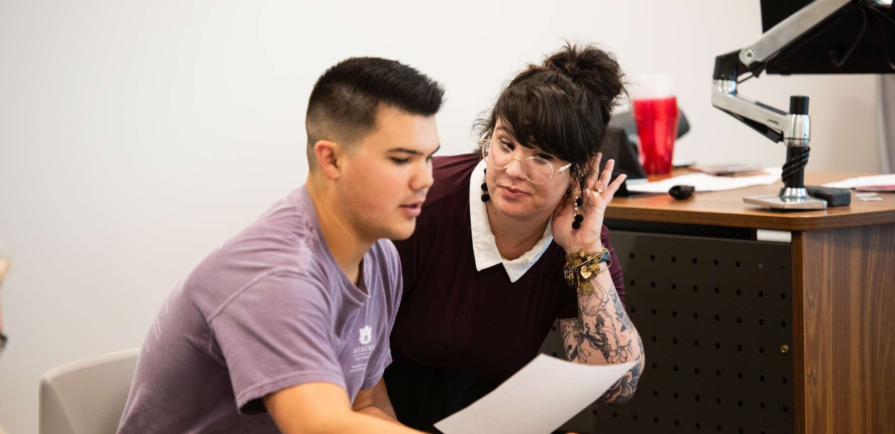 Student and teacher in a classroom 