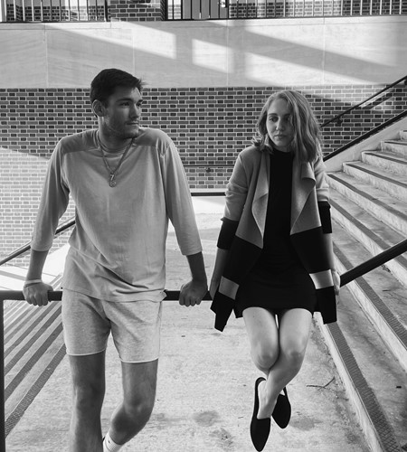 Senior students Justin Dowdle and Sydney Denardo posing for a photograph on stairs somewhere outdoors on the campus of Auburn University.