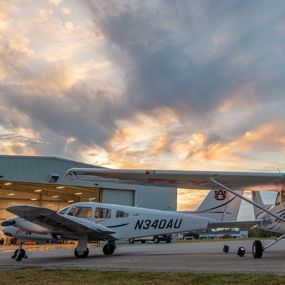 Auburn planes outside of a hangar