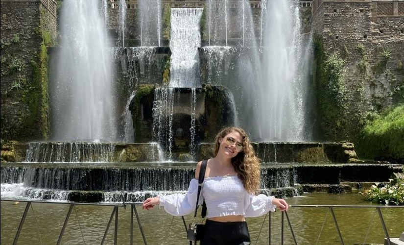 Sarah Walker in front of fountain