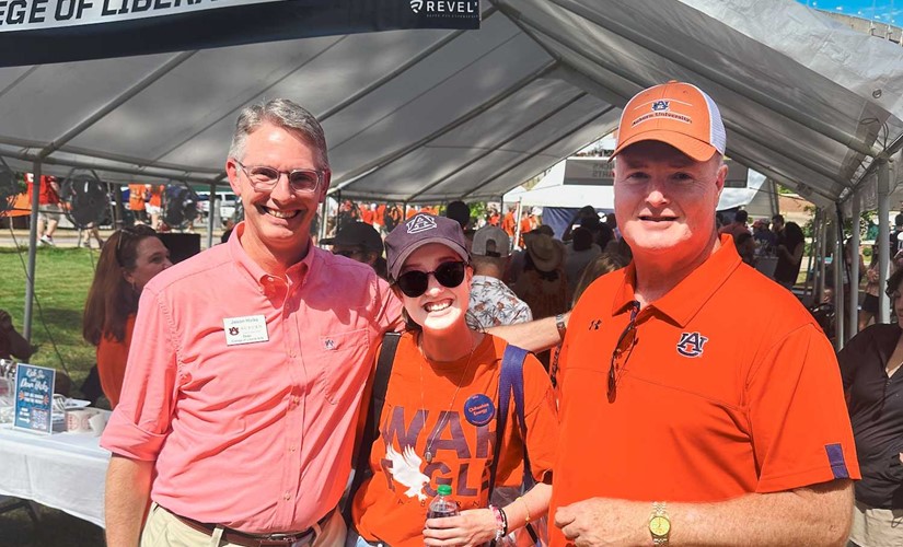 Dean Hicks with CLA alum at tailgate