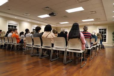 A room full of event guests at the center