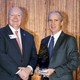 Steve Brown accepting award from Auburn University president Chris Roberts