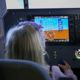 Child sitting in a plane simulator