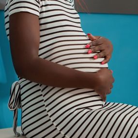 A pregnant woman waiting in a doctor's office