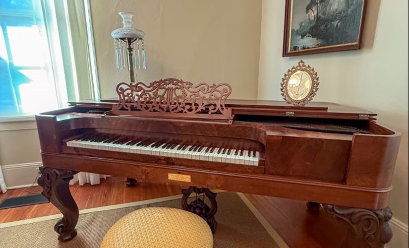 Steinway piano in room furnished with antiques