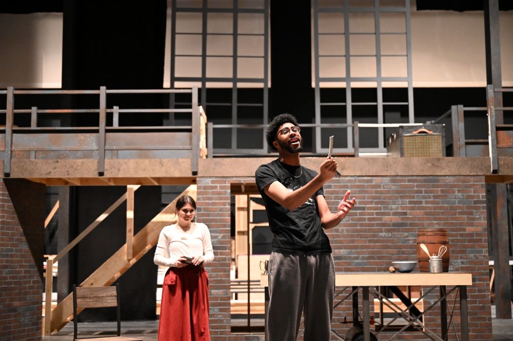 Actors playing Mrs. Lovett and Sweeney Todd rehearsing onstage