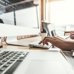 Hands typing on a keyboard 