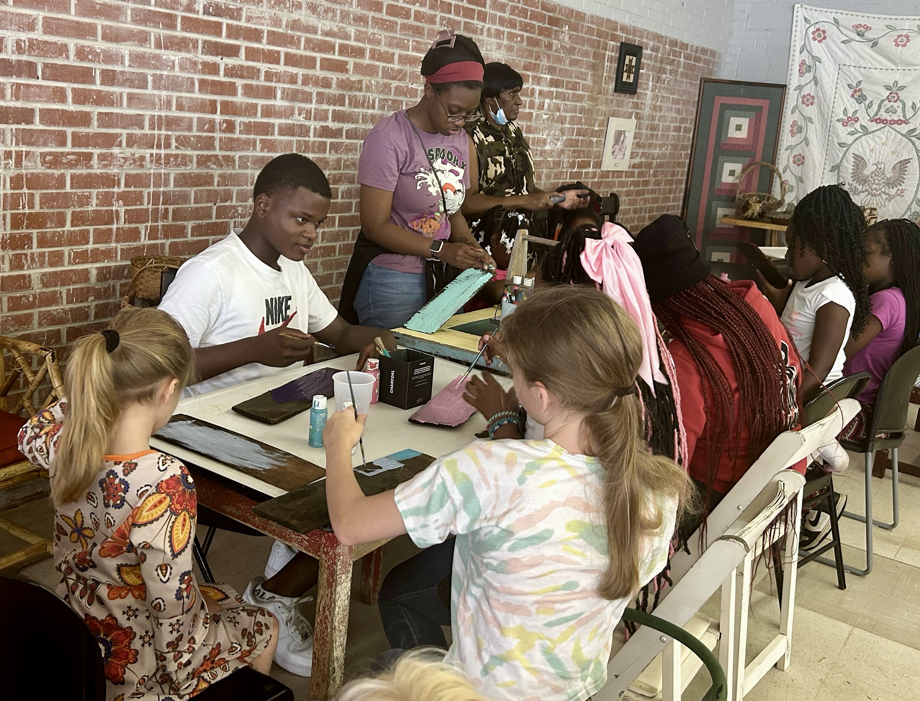 Youth create art projects during the Juneteenth festivities.