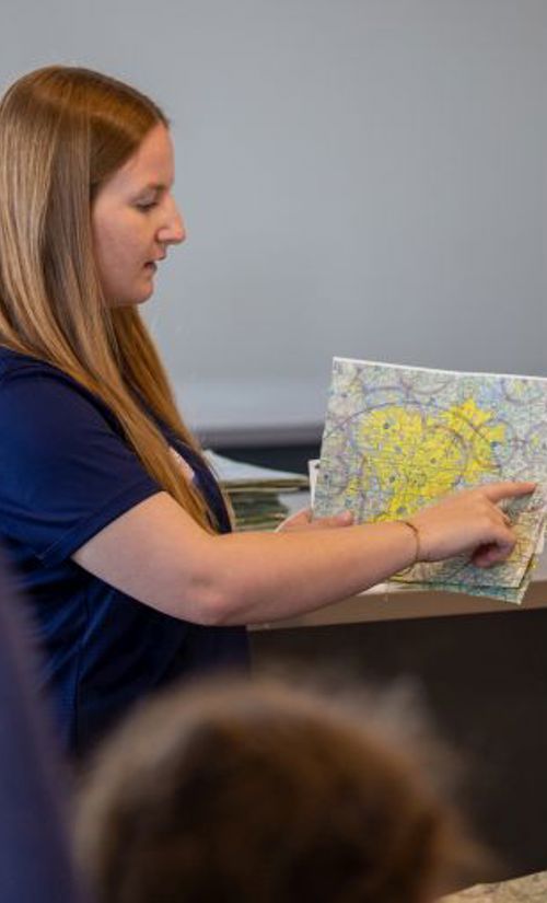 aviation student pointing at a map