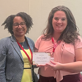Autumn Linford receiving Top Faculty Paper Award