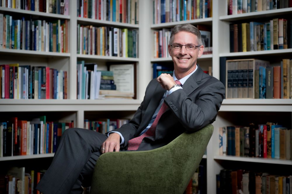 Dean Jason Hicks in the Center for Arts and Humanities library