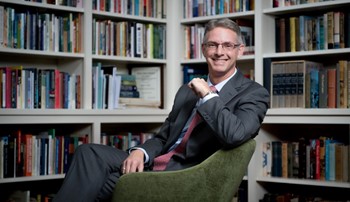 Dean Jason Hicks in the Center for Arts and Humanities library