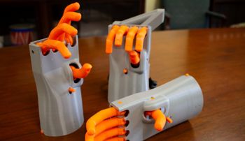 Three 3-D printed models of the Kassel Hand, a 16th-century prosthetic hand