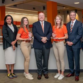Interim Provost Vini Nathan, Elizabeth Moorman, President Chris Roberts, Maggie Hearn, Dean Jason Hicks, Blake Bohannon and Nova pose with Iron Eagle Awards