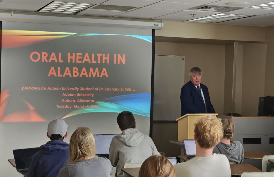 Dr. Tommy Johnson presenting a lecture to students