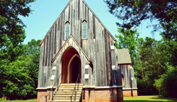A picture of St. Luke's Episcopal church, a carpenter-gothic chapel in Old Cahawba
