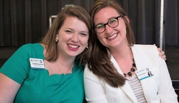 Two women posing for the camera