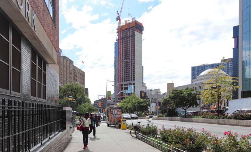Tall building under construction on Fulton Street in New York