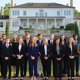 Students from across colleges selected as Foundation Fellows pose for a group photo outside the president's home