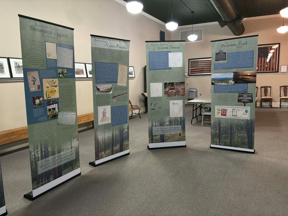 Posters from the William Bartram traveling exhibit describing his documentation of plants, animals and peoples native to Alabama on display