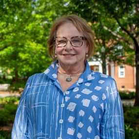 Susan Melton smiling for a photo on Auburn's campus