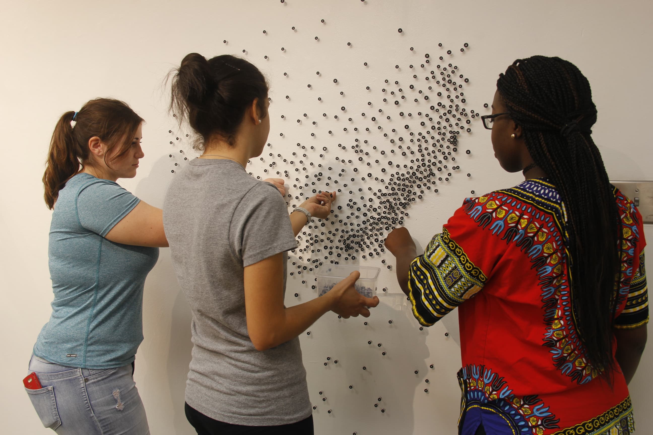 Students building an exhibit in the gallery