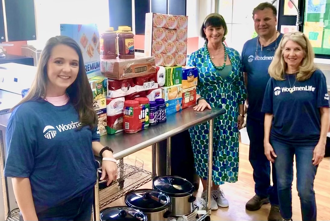 Chapter 1885 of the WoodmenLife nonprofit provides needed food items for the backpack program at Washington County High School. Shown left to right are Crimson Tarver, Kress Behlen, Larry Hubbard and Kimberly Hubbard. Contributed