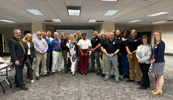 Representatives from East Alabama social services and the Opelika Police Department at the SIM training workshop