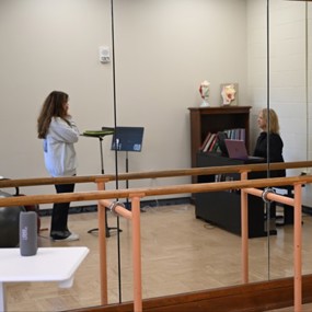 A student taking a lesson with Professor of Practice Charlotte Lee