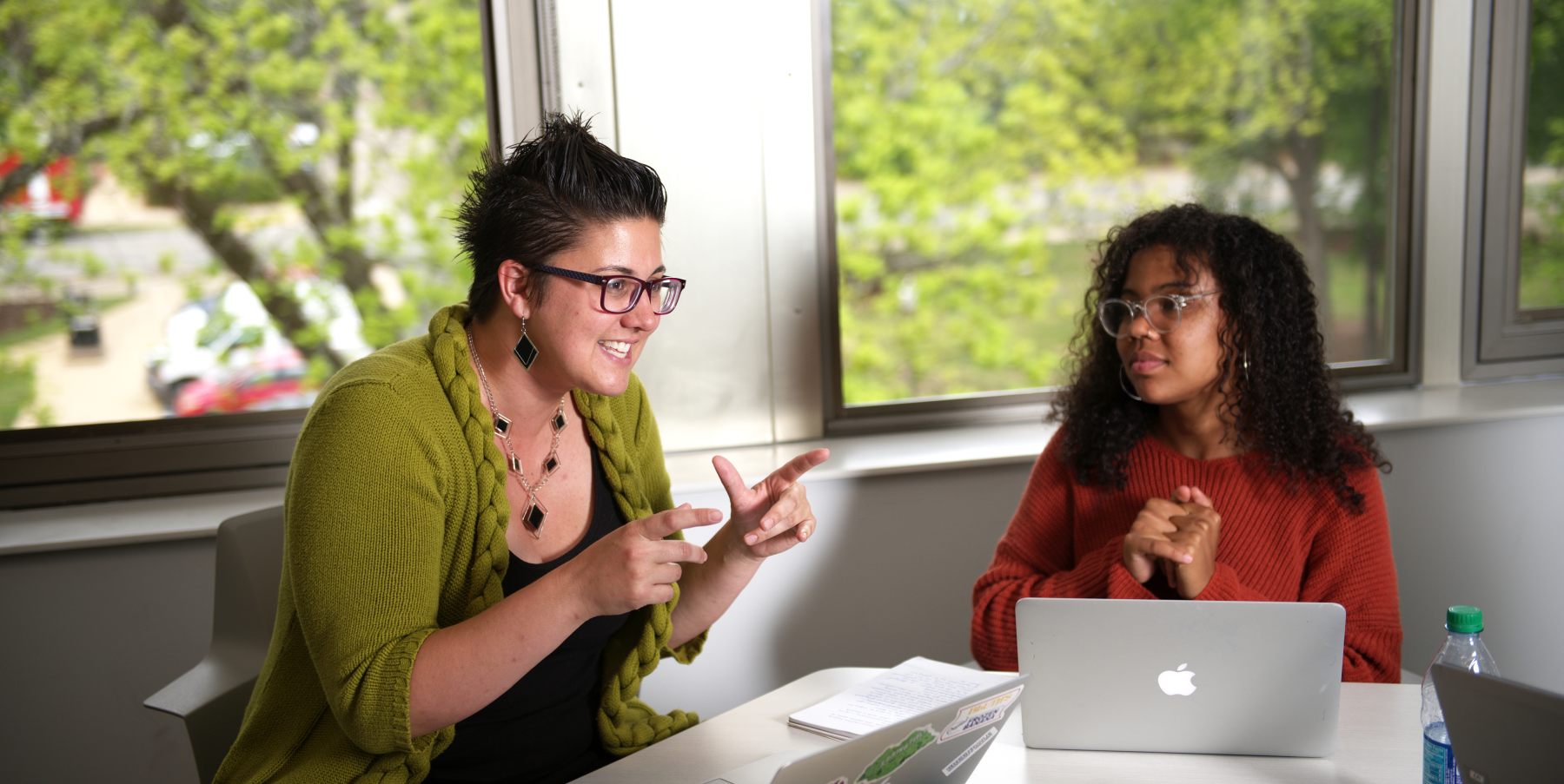 Professor sitting with a student