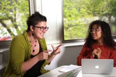 Professor sitting with a student