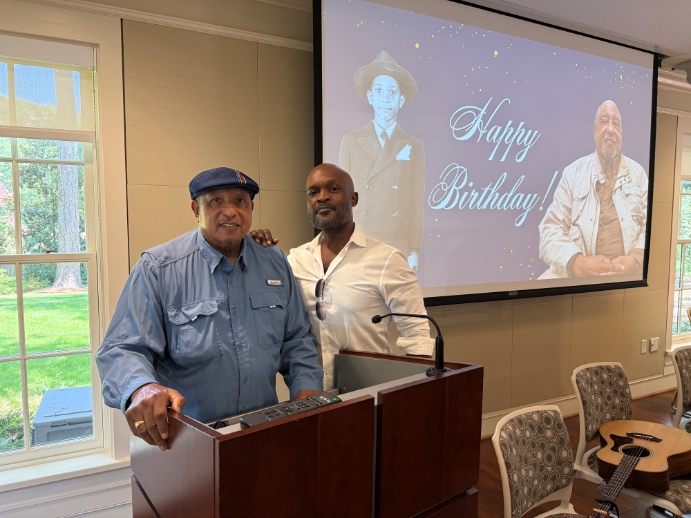 Dr. Bernard LaFayette Jr. and Khari Allen Lee posing for a photo at LaFayette's birthday celebration