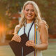 Katie Jett posing with graduation cap outside Samford Hall