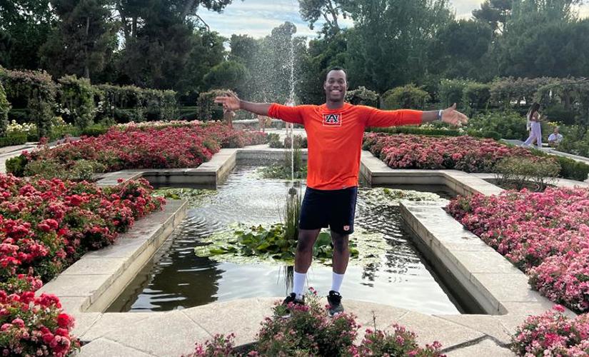 Oquendo Bernard stands in a garden in Spain