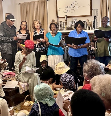 Community members celebrating Juneteenth crowd in Betty Anderson&#x27;s living room
