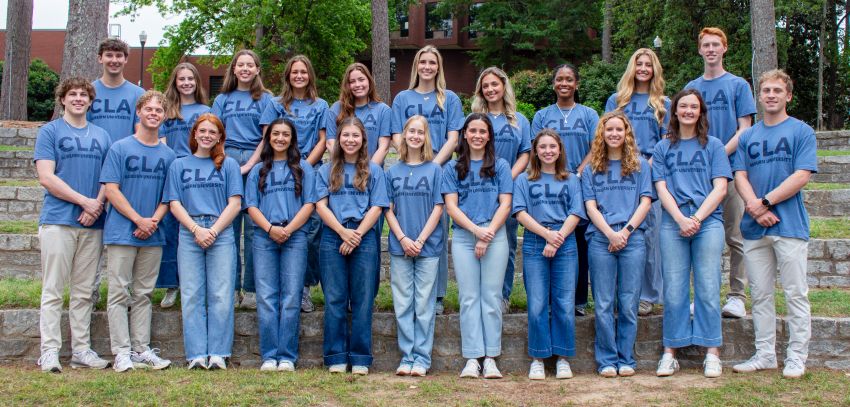 Group of students standing in two rows and posing for a photo