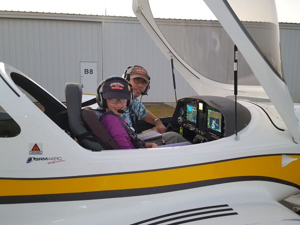 Alan Meyer and his daughter preparing for takeoff