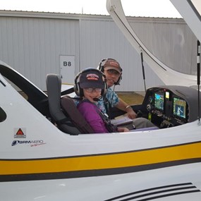Alan Meyer and his daughter preparing for takeoff